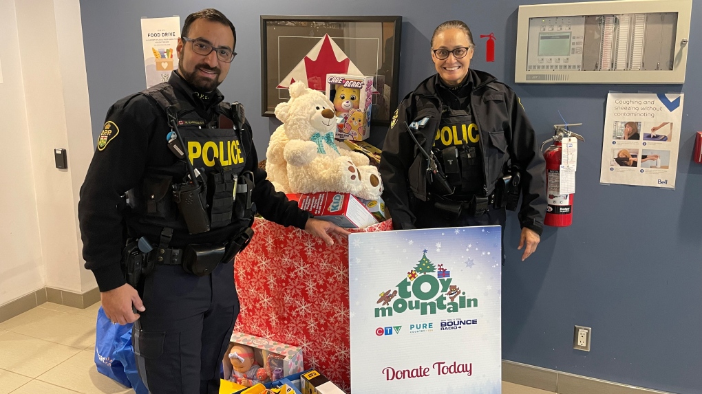 OPP Aurora Highway Safety Division constables Nicki Morris and Mohammad Kaddourah drop off dozens of donations to support CTV Toy Mountain on Dec. 4, 2023.  They hosted a ‘Stuff A Cruiser’ event held at Mapleview Drive Walmart in Barrie on Dec. 2. 