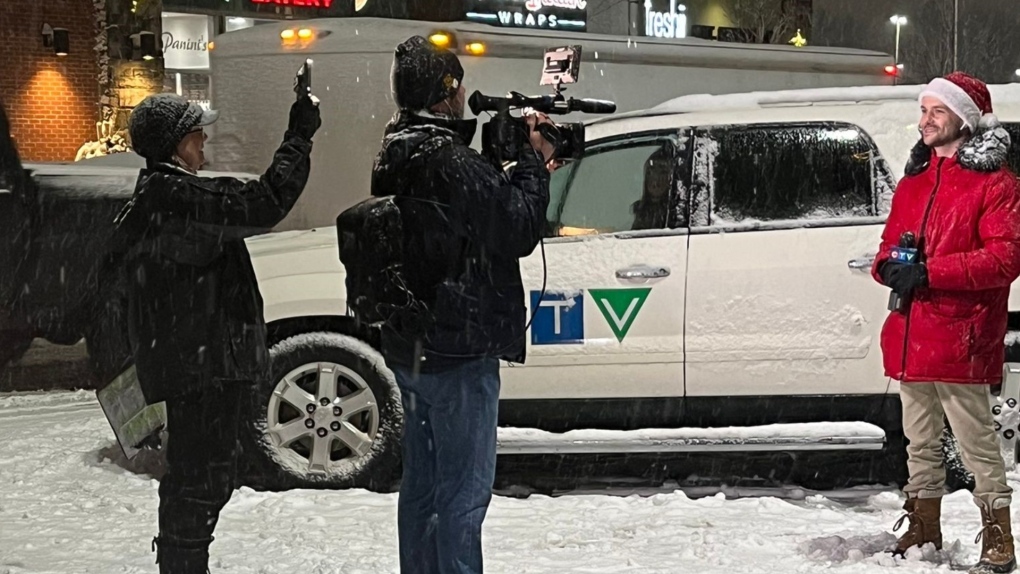 CTV Producer Tracy McReynolds, cameraman Dave Erskine, and reporter/anchor Dana Roberts broadcast live from Park Place for CTV Barrie's Toy Mountain Drive-Thru Drop-Off on Dec. 15.