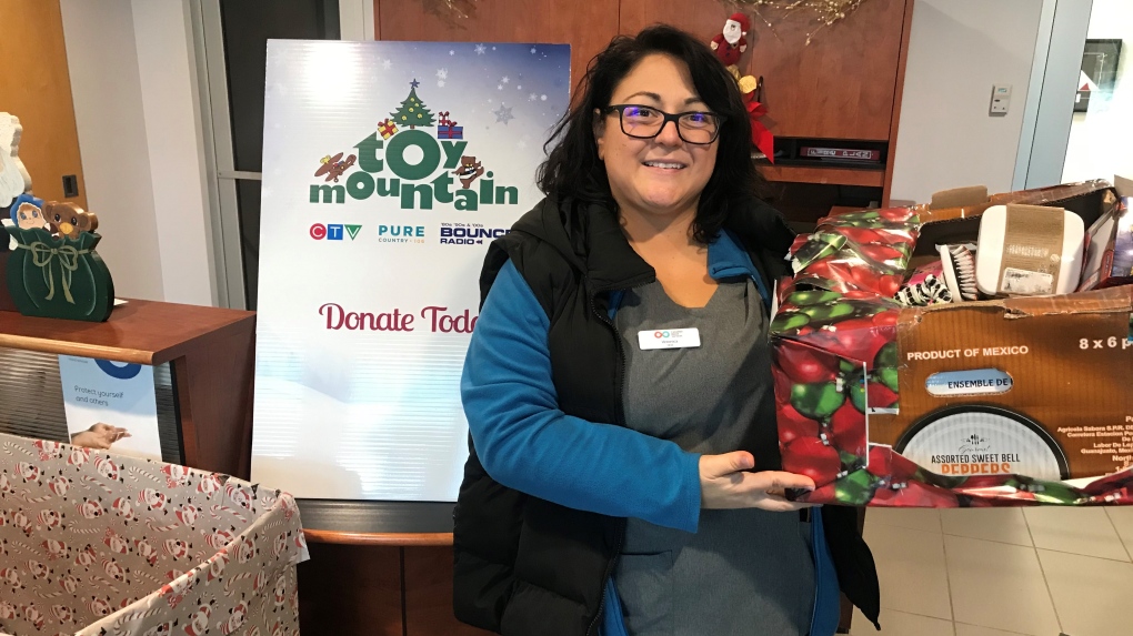 Veronica Youla from Canadian Blood Services dropped by CTV Barrie with toys and cash donated by staff for Toy Mountain. Thanks to all. 
