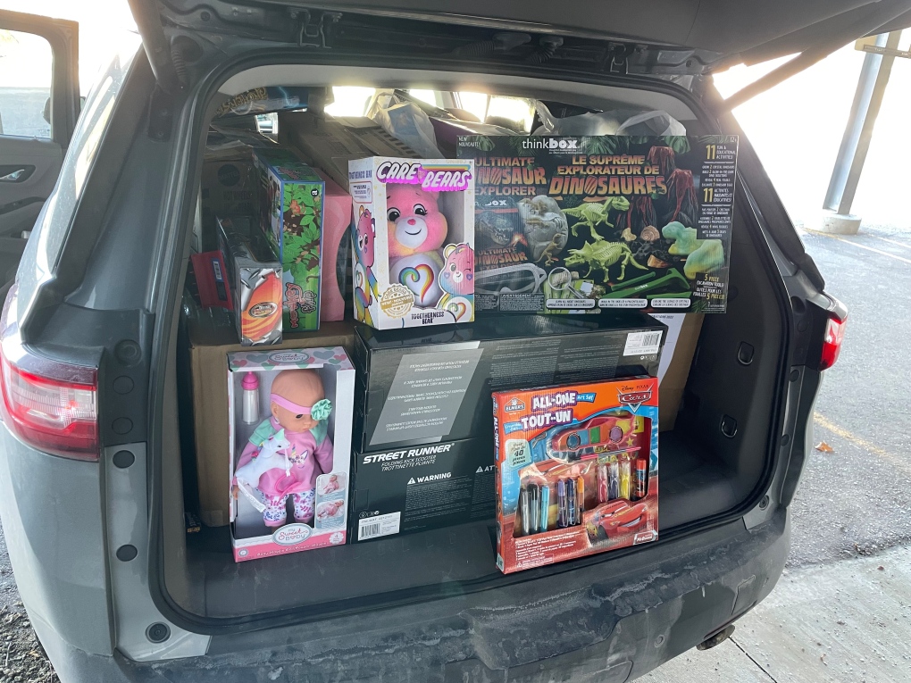 The first van-load drop-off of new, unwrapped toys arrives.