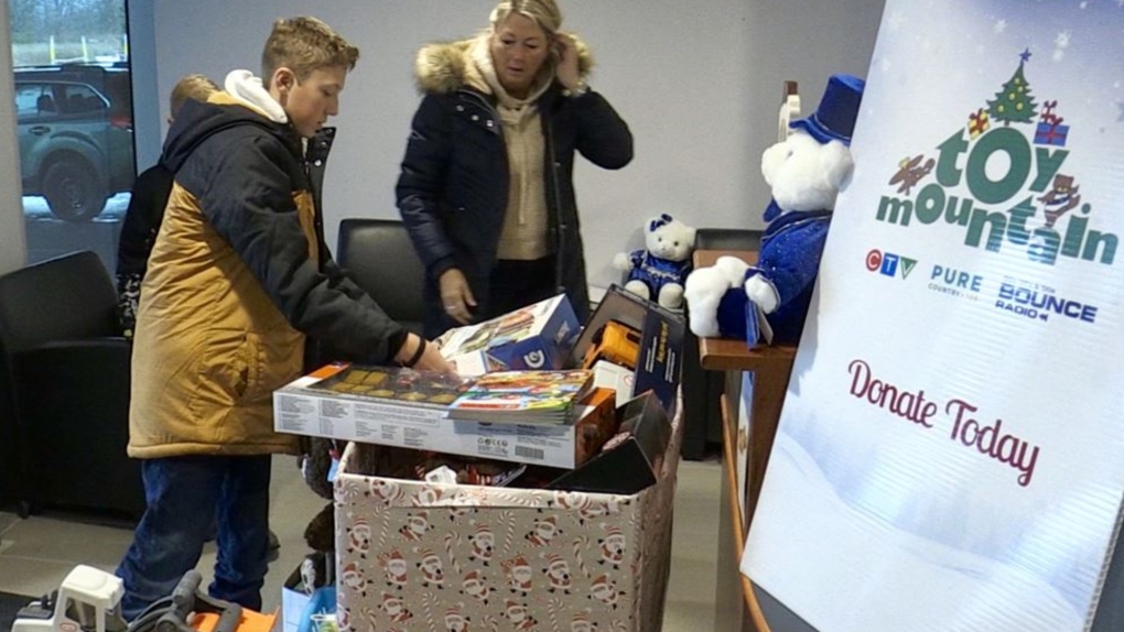 The boys helped do some shopping to add toys to the donations.