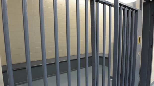 A picture of a jail cell is shown in this photo.