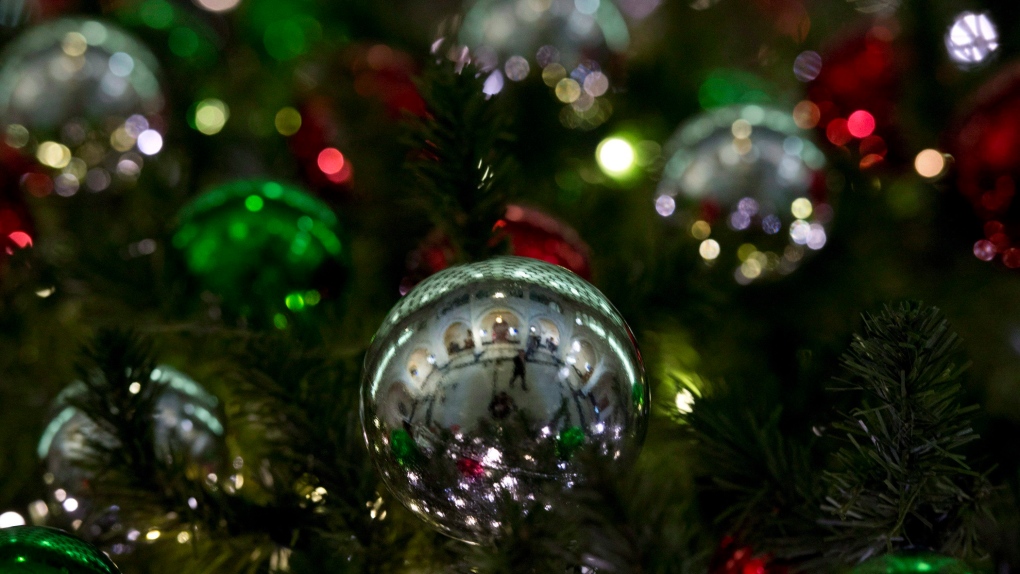 Christmas decorations adorn a tree in Ottawa in a Dec.14, 2014 file photo. (Adrian Wyld/THE CANADIAN PRESS)