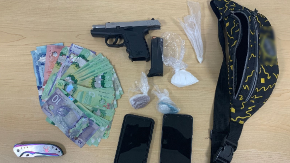 Police display cash, cell phones, suspected fentanyl, suspected cocaine, a prohibited knife, and a 9mm semi-automatic weapon. (Barrie Police Services)