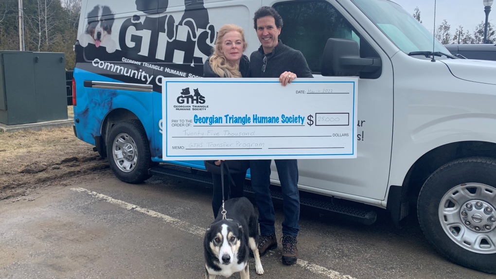 Lynn (left) and Derrick (right) of the Zoey Foundation present a cheque to the Georgian Triangle Humane Society (Supplied)
