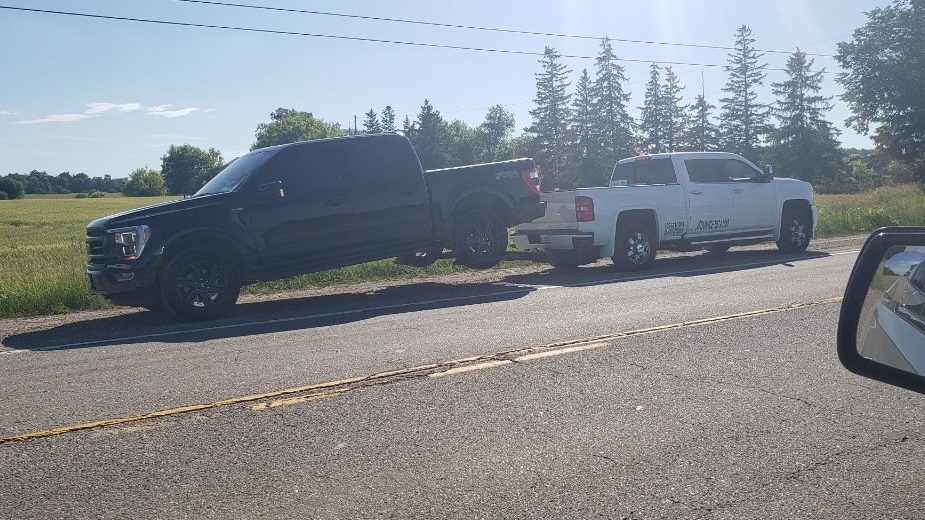 A pickup truck is loaded onto a tow truck in Caledon, Ont., on Wed., June 22, 2022 (OPP_CR/Twitter)