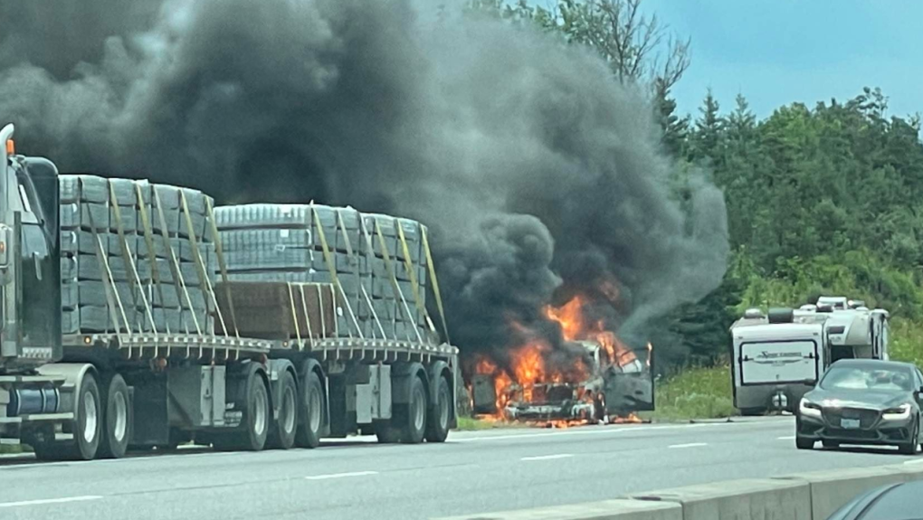 Emergency crews attend the scene of a vehicle fire along Highway 400 through Bradford, Ont., on Thurs., July 28, 2022. (Viewer Photo)