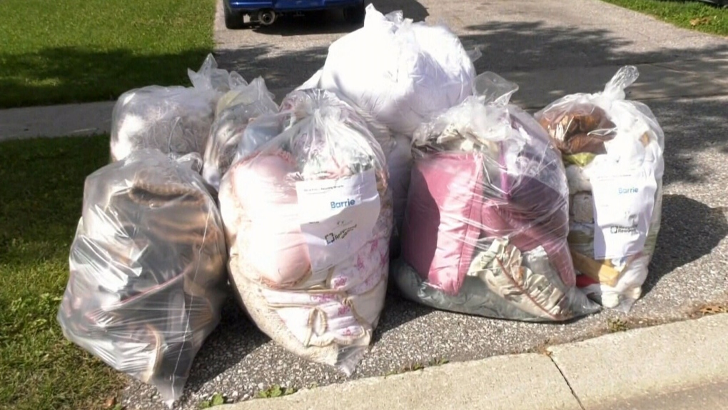 Items are left in clear garbage bags at the curb in Barrie, Ont. (CTV NEWS)