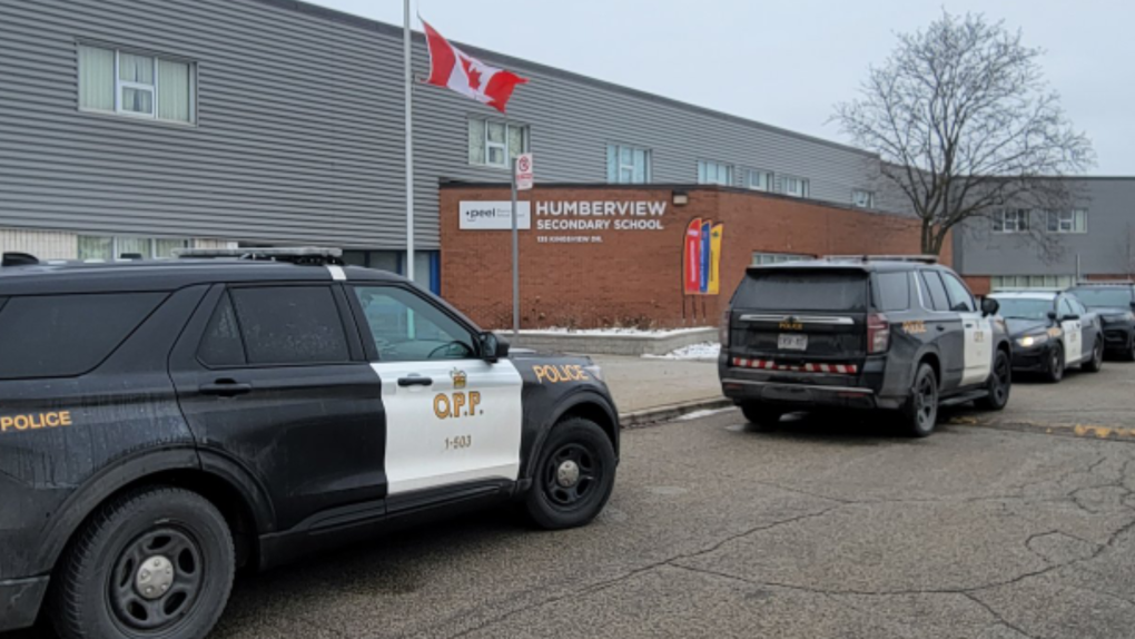 Police vehicles are parked outside Humberview Secondary School in Bolton, Ont., on Wed., Jan. 25, 2023 (OPP/Twitter)