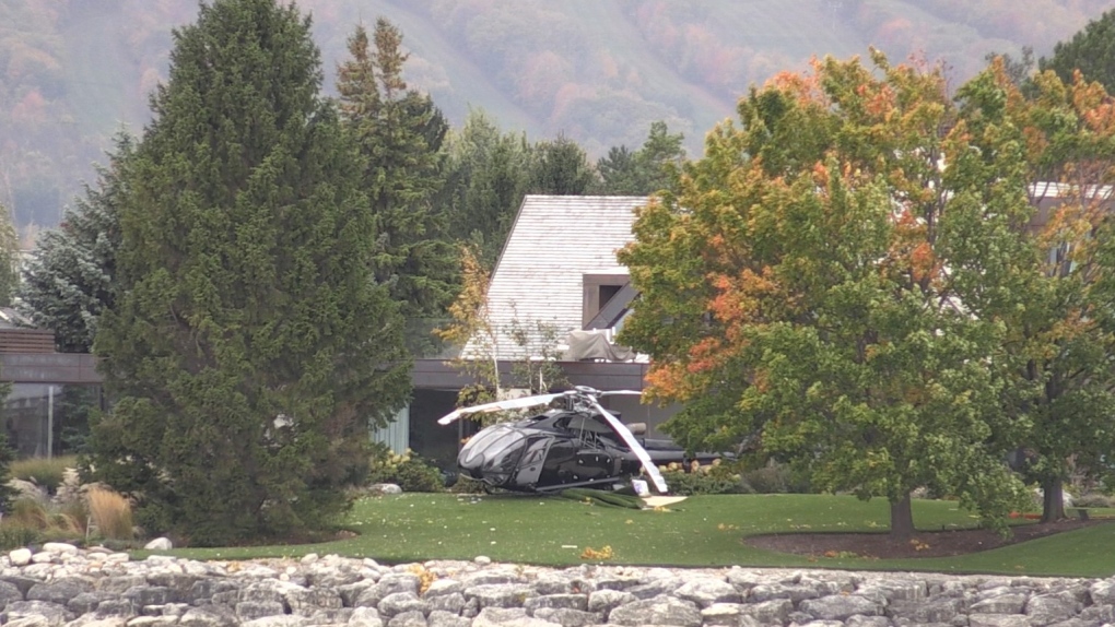 A helicopter is seen crashed onto a waterfront property in Collingwood, Ont., on Mon., Oct. 16, 2023. (CTV News/Alessandra Carneiro)