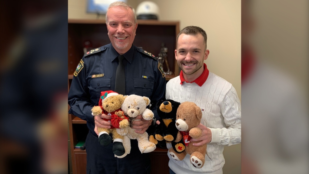 South Simcoe Police Chief John Van Dyke and CTV News Anchor Dana Roberts show some of the toys ready for the Weekend of Giving in Innisfil Dec. 8 and 9. 