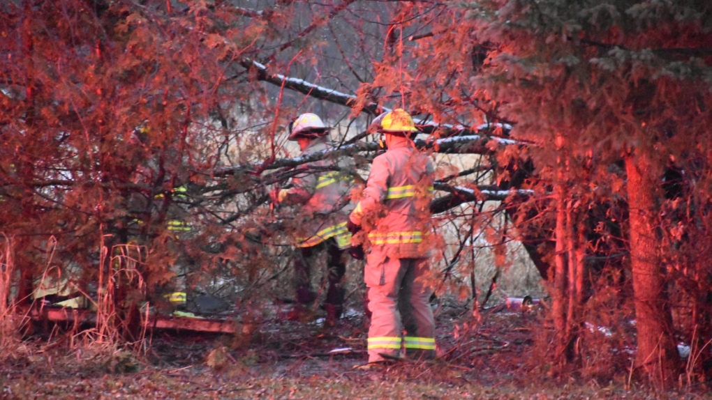 Firefighters work to control a shed fire in a wooded area on Yonge Street in Elmvale, Ont., on Sun., Dec. 4, 2023. (Courtesy: Michael Chorney/At the Scene Photography)
