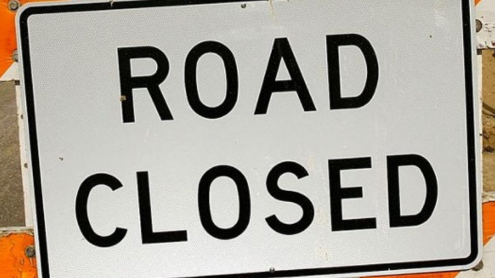 A road closed sign in this file image. 