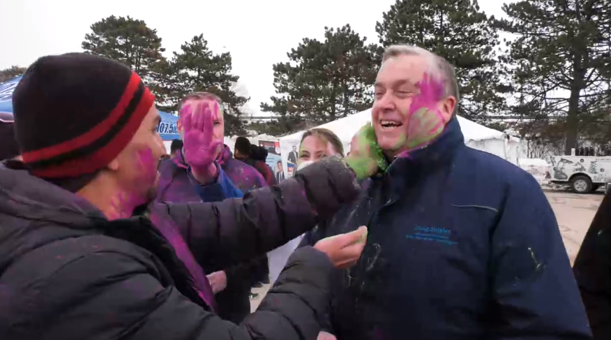 Organizer Shakir Barmare puts Holi colour powder on the face of Barrie-Springwater-Oro-Medonte MP Doug Shipley at the Barrie Holi Fest on Sun., March 12 (Christopher Garry/CTV News). 