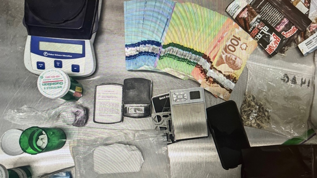 Police display evidence allegedly seized during a traffic stop in Springwater Township on Fri., March 17, 2023. (Police Handout)