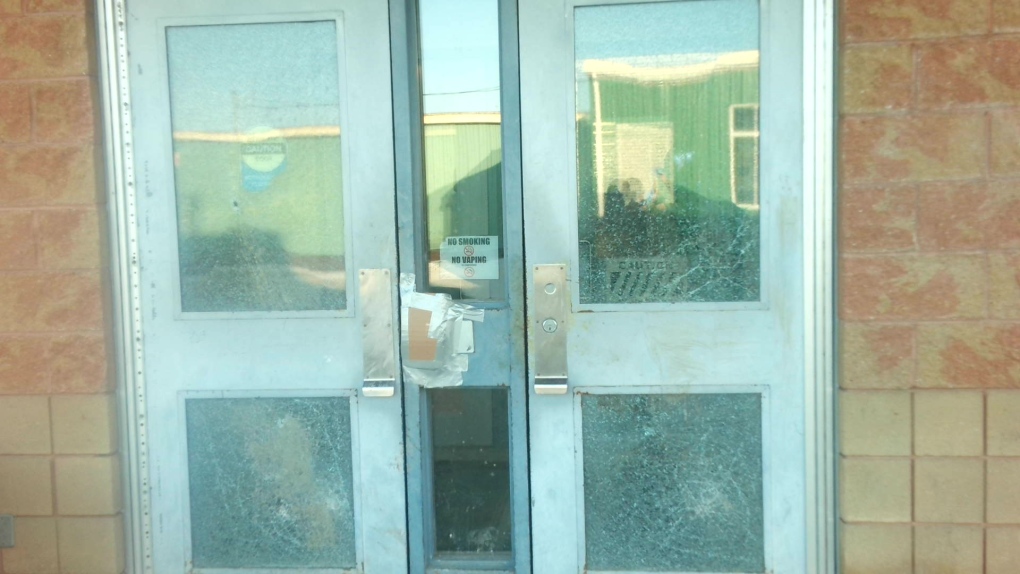 Windows and doors are damaged by BB guns, according to OPP, at Holy Family Catholic School in Alliston, Ont. (OPP/Twitter)