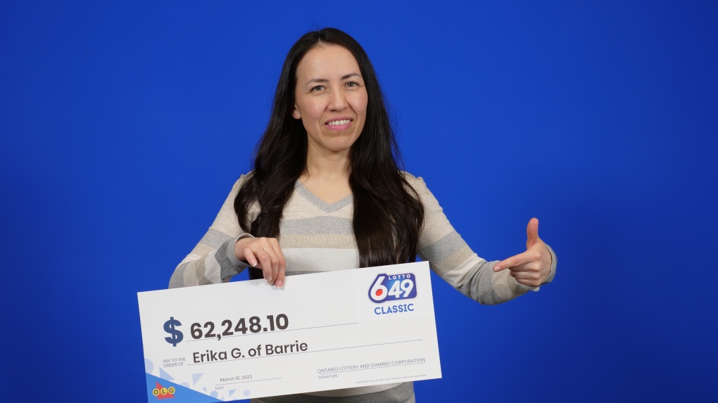 Erika Fabiola Gomez Cruz of Barrie, Ont., holds her big cheque after winning in the Lotto 6/49 Feb. 8, 2023, draw. (OLG)