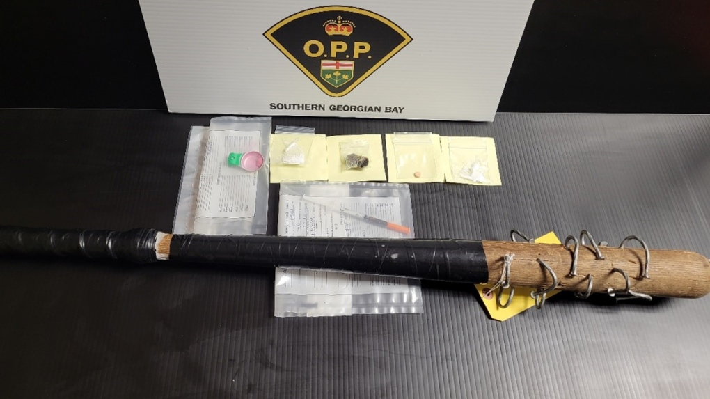 Police release an image of a wooden baseball bat loaded with nails allegedly seized from a residence in Midland, Ont., on Wed., May 24, 2023. (Supplied)