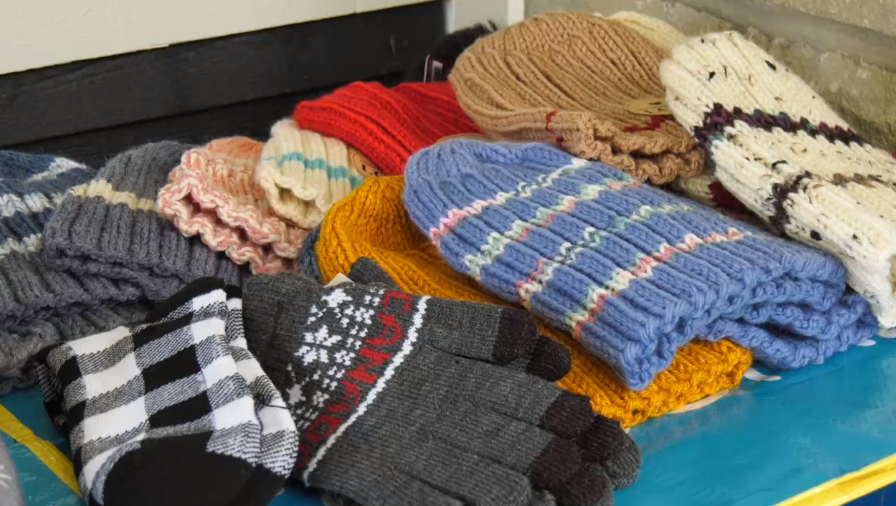 Hats and mittens collected by Warm and Cozy Children's Charity shown on display on Mon. Sept. 25, 2023 (CTV News/Chris Garry). 